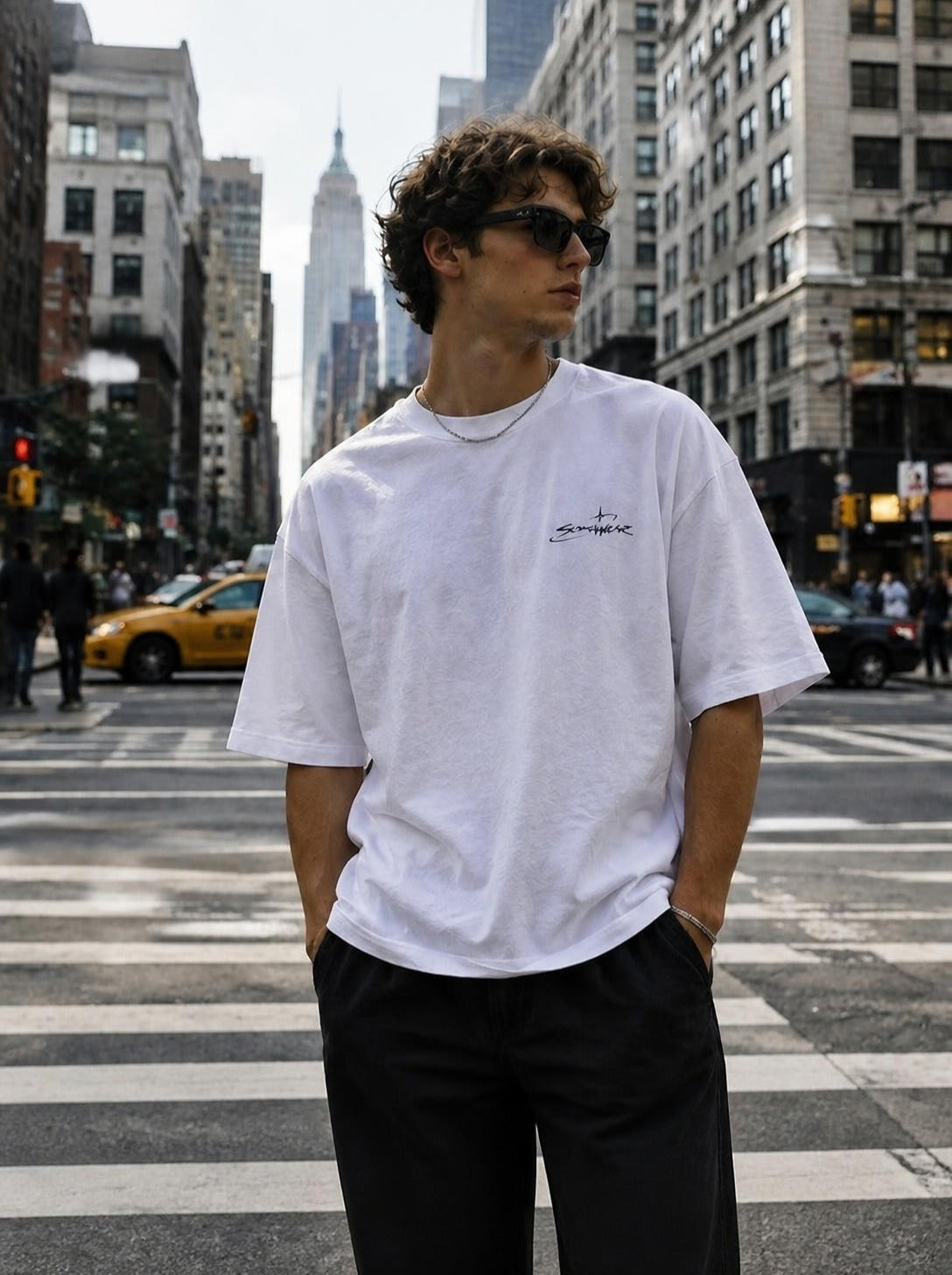 White Somewear logo tee on a city crosswalk