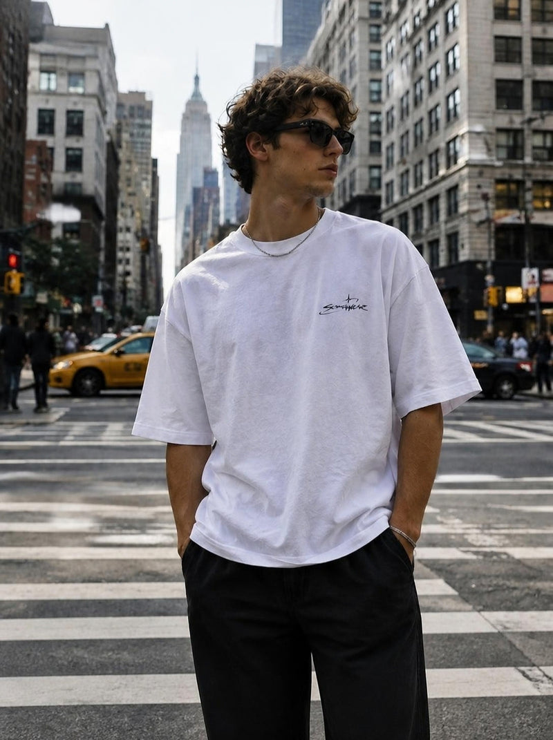 White Somewear logo tee on a city crosswalk